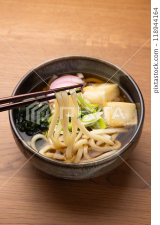 Chikara udon noodles topped with grilled mochi Chikara udon noodles topped with grilled mochi 118944164