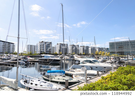 Yacht parking. A marina lot. Yacht and sailboat is moored at the quay. 118944992