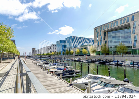 Modern and expensive area in Copenhagen with new luxury houses and a pier for yachts. Modern and expensive area in Copenhagen with new luxury houses and a pier for yachts. 118945024