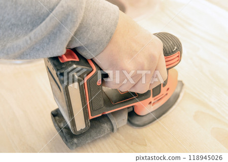 Work with a grinder on wood. Work tool. Work with a grinder on wood. Work tool. 118945026