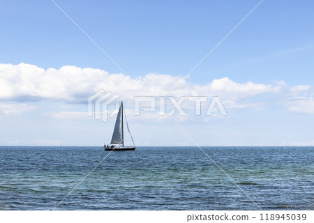 Beautiful seascape. Sailboat floats on the blue sea. 118945039