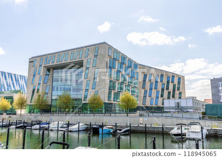 Modern and expensive area in Copenhagen with new luxury houses and a pier for yachts. Modern and expensive area in Copenhagen with new luxury houses and a pier for yachts. 118945065