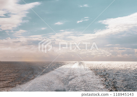 Water trail behind cruise ship. 118945143