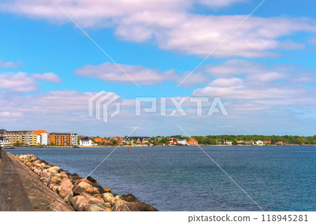 Beautiful summer seascape. Seafront with city view. Beautiful summer seascape. Seafront with city view. 118945281
