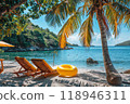Sunny Seaside Retreat: sun loungers under palm tree on beautiful coastal beach. 118946311