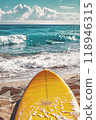 Sunny Seaside Retreat: sun loungers under palm tree on beautiful coastal beach. 118946315