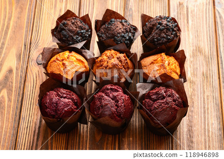 Mix of muffins ( cupcake ) chocolate , vanilla , berries . Top view Mix of muffins ( cupcake ) chocolate , vanilla , berries . Top view 118946898