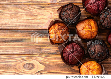 Mix of muffins ( cupcake ) chocolate , vanilla , berries . Top view Mix of muffins ( cupcake ) chocolate , vanilla , berries . Top view 118946899