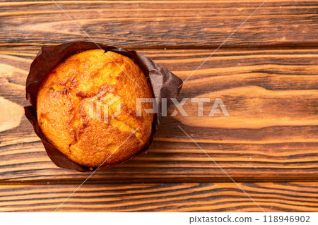 Sweet Baked vanilla muffins ( cupcake )  . Top view 118946902