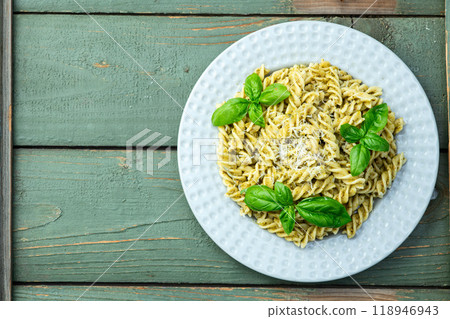 Pasta with basil sauce pesto . Italian food photography . Top view Pasta with basil sauce pesto . Italian food photography . Top view 118946943