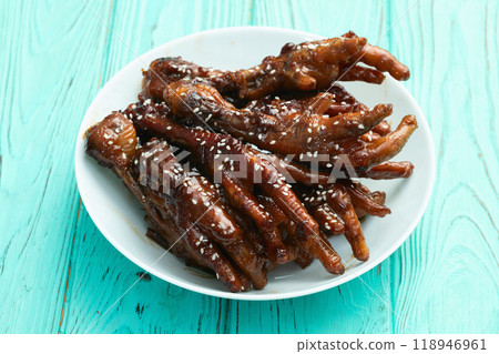 Caramelized korean or Chinese chicken foots ( paws ) with sesame . Top view Caramelized korean or Chinese chicken foots ( paws ) with sesame . Top view 118946961