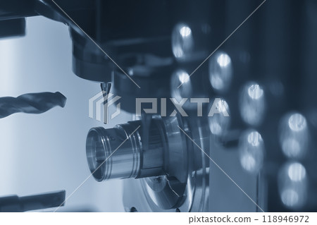 The CNC lathe machine swiss type hole drilling process on the metal shaft parts. The CNC lathe machine swiss type hole drilling process on the metal shaft parts. 118946972