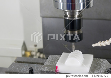 The CNC milling machine cutting the nylon parts with solid ball end mill tool. The CNC milling machine cutting the nylon parts with solid ball end mill tool. 118946977