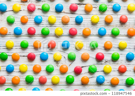 colorful candies as background top view. Seamless pattern with candy. Many sweet candies close-up 118947546