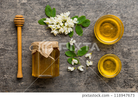honey jar with acacia flowers and leaves. fresh honey top view flat lay 118947673