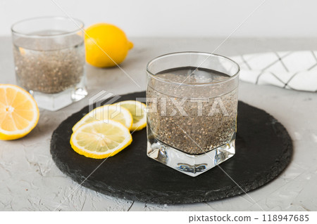Healthy breakfast or morning with chia seeds and lemon on table background, vegetarian food, diet and health concept. Chia pudding with lemon Healthy breakfast or morning with chia seeds and lemon on table background, vegetarian food, diet and health concept. Chia pudding with lemon 118947685