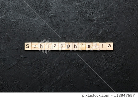 schizophrenia word written on wood block. schizophrenia text on table, concept 118947697