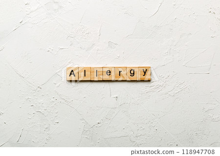 Allergy word written on wood block. Allergy text on cement table for your desing, concept 118947708