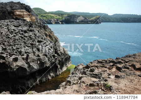 Landscape of rocky cliff at the sea and destination travel summer ocean in Bali island at Indonesia 118947784