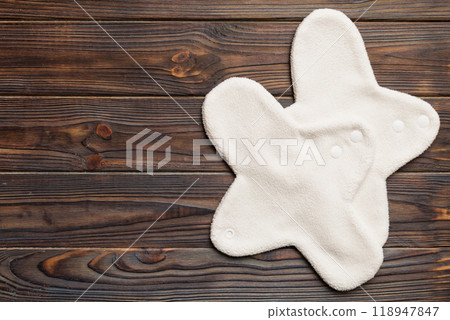 Eco-friendly reusable fabric women's pads. set of colorful bright reusable menstrual pads. zero waste woman periods concept top view with copy space Eco-friendly reusable fabric women's pads. set of colorful bright reusable menstrual pads. zero waste woman periods concept top view with copy space 118947847