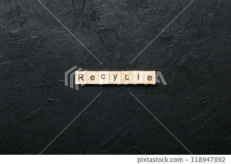 recycle word written on wood block. recycle text on cement table for your desing, concept 118947892