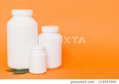 supplement pills with medicine bottle health care and medical top view. Vitamin tablets. Top view mockup bottle for pills and vitamins with green leaves, natural organic bio supplement, copy space supplement pills with medicine bottle health care and medical top view. Vitamin tablets. Top view mockup bottle for pills and vitamins with green leaves, natural organic bio supplement, copy space 118947899