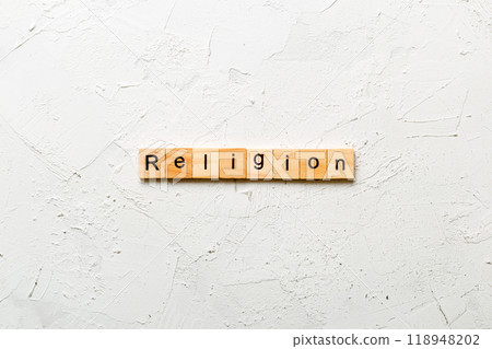 Religion word written on wood block. Religion text on cement table for your desing, concept Religion word written on wood block. Religion text on cement table for your desing, concept 118948202