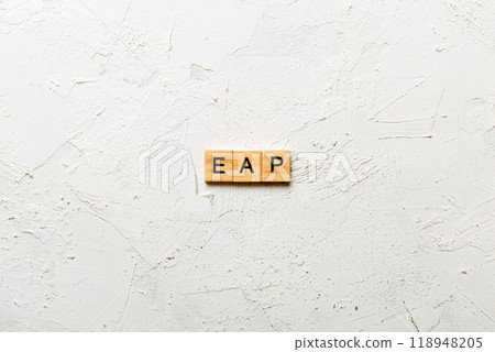 EAP word written on wood block. employee assistance program text on table, concept 118948205