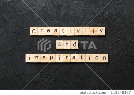 creativity and inspiration word written on wood block. creativity and inspiration text on cement table for your desing, concept creativity and inspiration word written on wood block. creativity and inspiration text on cement table for your desing, concept 118948367