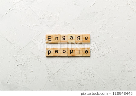 ENGAGE PEOPLE word written on wood block. ENGAGE PEOPLE text on cement table for your desing, concept ENGAGE PEOPLE word written on wood block. ENGAGE PEOPLE text on cement table for your desing, concept 118948445