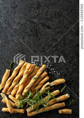 Homemade grissini breadsticks with sea salt and rosemary. Homemade grissini breadsticks with sea salt and rosemary. 118948568