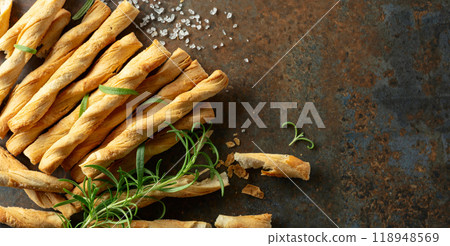 Homemade grissini breadsticks with sea salt and rosemary. 118948569