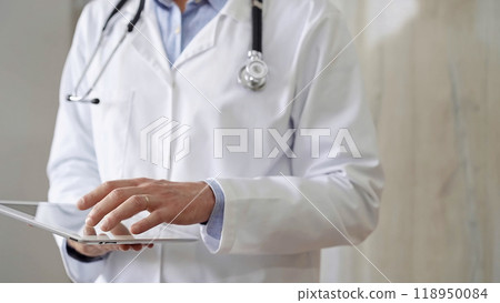 Doctor man with stethoscope using tablet computer in hospital. Medicine and science concepts 118950084