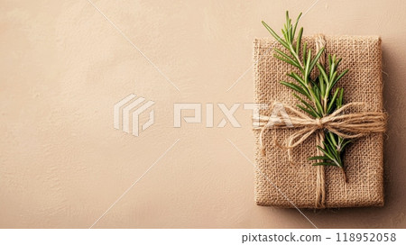 Rustic Gift Box Wrapped in Burlap with Rosemary Sprig - Perfect Design for Holiday Cards and Posters 118952058