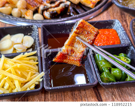 Korean food. Grilled eel. Three flavors. Spicy sauce, salt, soy sauce Korean food. Grilled eel. Three flavors. Spicy sauce, salt, soy sauce 118952215