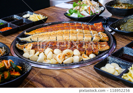 Korean food. Grilled eel. Three flavors. Spicy sauce, salt, soy sauce Korean food. Grilled eel. Three flavors. Spicy sauce, salt, soy sauce 118952256
