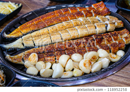 Korean food. Grilled eel. Three flavors. Spicy sauce, salt, soy sauce Korean food. Grilled eel. Three flavors. Spicy sauce, salt, soy sauce 118952258