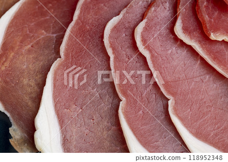 sliced ham with bacon on a board sliced ham with bacon on a board 118952348