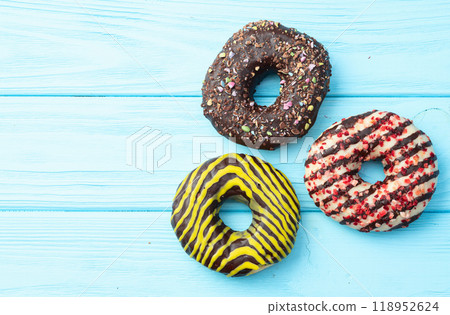 Sweet glazed colorful donuts . Top view Sweet glazed colorful donuts . Top view 118952624
