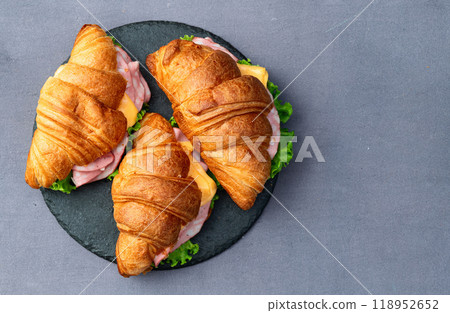 Croissant sandwich with salad ham and cheese . Top view 118952652