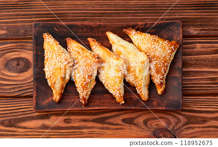 Homemade triangle puff pastry with meat on rustic background . Samosa 118952675