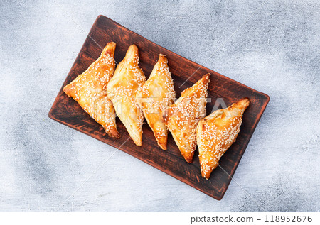 Homemade triangle puff pastry with meat on rustic background . Samosa 118952676