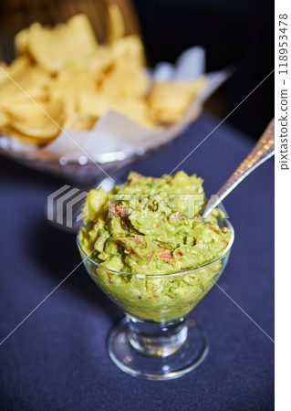 Fresh Guacamole with Tortilla Chips in Elegant Indoor Setting 118953478