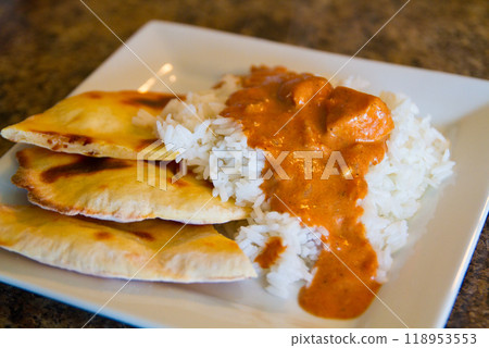 Inviting Plate of Traditional Indian Cuisine with Curry, Rice and Naan Bread Inviting Plate of Traditional Indian Cuisine with Curry, Rice and Naan Bread 118953553