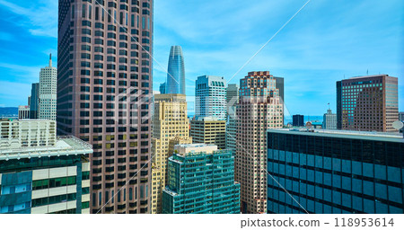Tops of San Francisco downtown skyscraper buildings aerial on cloudy blue sky day, CA Tops of San Francisco downtown skyscraper buildings aerial on cloudy blue sky day, CA 118953614