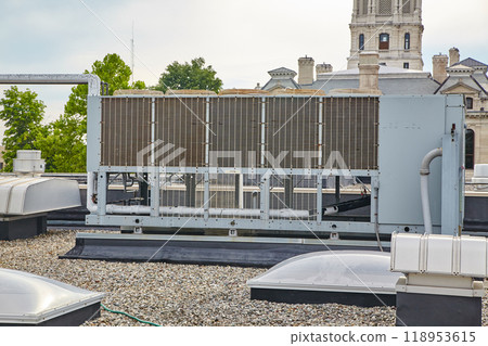 Industrial HVAC Unit on Historical Building Rooftop Industrial HVAC Unit on Historical Building Rooftop 118953615