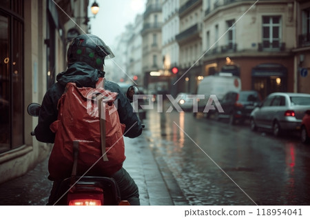 Courier on scooter in rainy city street Courier on scooter in rainy city street 118954041