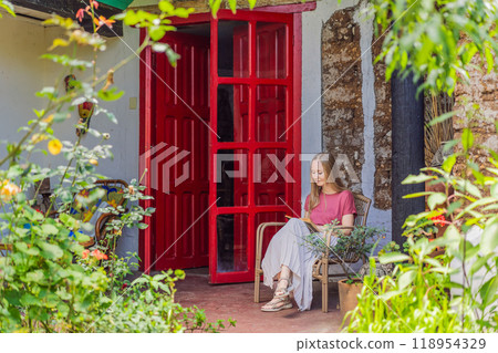 Female tourist in a colonial house in San Cristobal de las Casas, Mexico. Cultural exploration, architecture, and travel experience concept 118954329