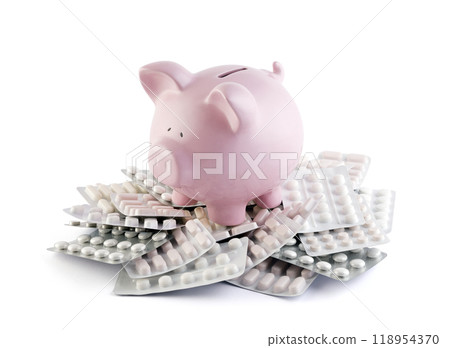 Pink piggy bank on heap of many various pills and tablets packs for savings and healthcare concept Pink piggy bank on heap of many various pills and tablets packs for savings and healthcare concept 118954370
