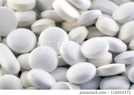 Heap of medicine white pills macro shot Heap of medicine white pills macro shot 118954372